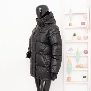 May include: A set of three ceramic mugs with a speckled, matte finish. The mugs are in shades of cream, light gray, and dark gray. Each mug has a simple, minimalist design, perfect for coffee or tea.