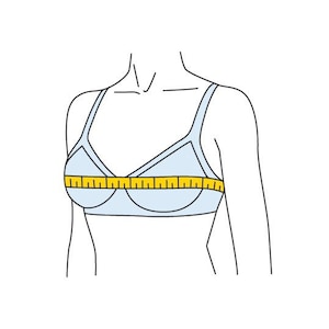 May include: A white bra with a yellow measuring tape across the bust line.