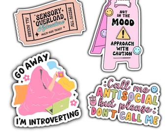 May include: Set of four pink and colorful stickers with humorous text. The stickers feature phrases like "Sensory Overload Adventure", "Go Away I'm Introverting", "Not in the Mood Approach with Caution", and "Call me Antisocial but please don't call me".