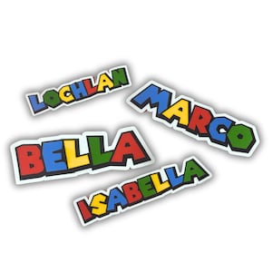 May include: Four colorful stickers with names written in a blocky font. The names are "Lochlan", "Marco", "Bella", and "Isabella".
