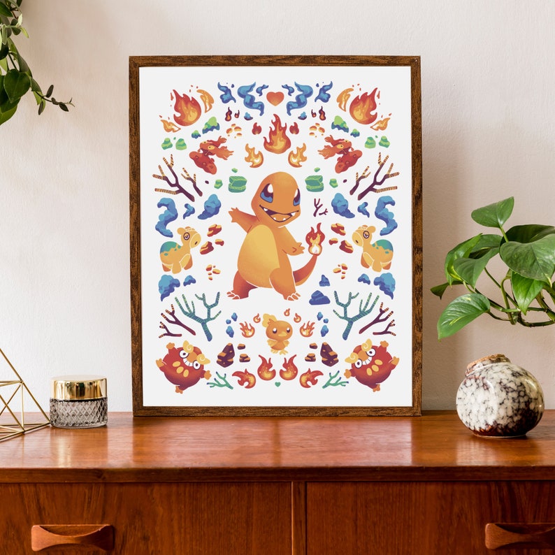 May include: A framed print featuring a cartoon illustration of a fire-type Pokemon, Charmeleon, surrounded by flames and other fire-type Pokemon. The print has a white background and a brown frame.