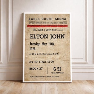 Könnte beinhalten: Ein gerahmtes Vintage-Konzertplakat für Elton John in der Earls Court Arena vom 11. Mai 1976. Das Plakat zeigt schwarzen und roten Text auf beigem Hintergrund mit Details zur Show.