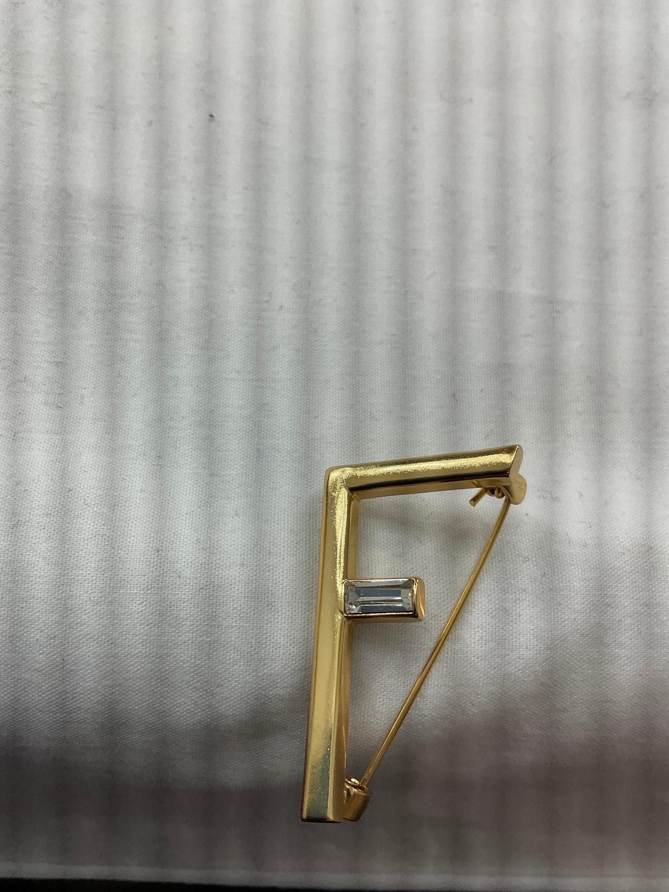 gold lv brooch