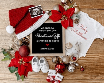 May include: A festive announcement featuring a red and white Santa hat, baby shoes, and a onesie with "Baby Matthews" in red script. A chalkboard reads "We tried to hide it but our Christmas Gift is starting to show! Arriving April."