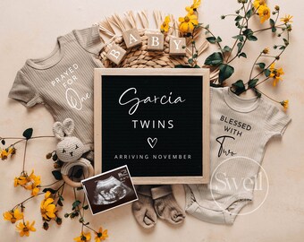 May include: A black chalkboard sign with the text "Garcia Twins Arriving November" and a heart symbol. Two baby onesies, one with the text "Prayed for One" and the other with the text "Blessed with Two". A wooden baby rattle with a bunny attached. An ultrasound image.