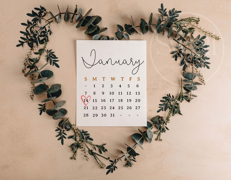 May include: A white calendar with the month of January displayed. The number 14 is circled with a red heart.
