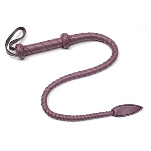 May include: A purple leather braided whip with a knotted handle and a pointed tip.