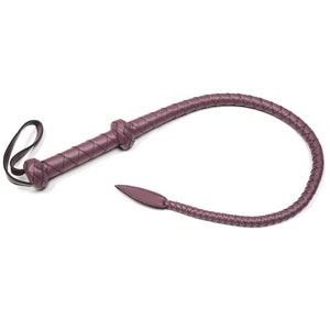 May include: A purple leather whip with a braided handle and a pointed tip.