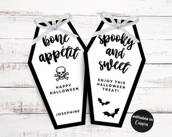 May include: Two coffin-shaped Halloween gift tags with black borders and white backgrounds. One says "bone appétit" with a skull and crossbones, the other says "spooky and sweet" with bats. Both have white bows.