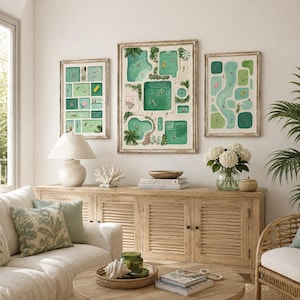 May include: Three framed art prints depicting aerial views of swimming pools in shades of green and blue, displayed on a wall above a wooden sideboard. The artwork features various pool shapes, swimmers, and lounge chairs in a grid-like layout.
