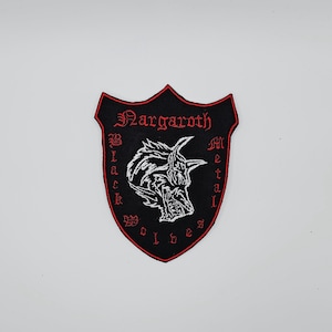 May include: Black and red embroidered patch with the text "Margaroth Black Metal Wolves". The patch features a shield shape with a wolf illustration in the centre.