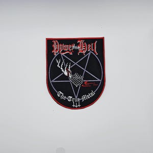 May include: Black patch with red trim featuring the text "Power from Hell" in a gothic font. A white skeletal hand and a pentagram are in the center. The text "The True Metal" is below the pentagram.