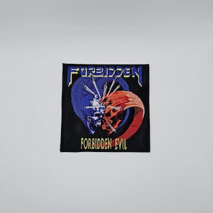 May include: Square black patch with the word "FORBIDDEN" in yellow above a blue and red skull design. The words "FORBIDDEN EVIL" are in yellow below the skull graphic. The patch is embroidered.