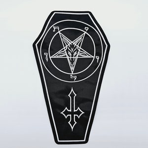 May include: Black and white embroidered patch shaped like a coffin with a pentagram and inverted cross. The pentagram has a goat's head in the center.