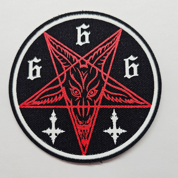 May include: A black and white patch with a red pentagram featuring a goat's head inside. The pentagram is surrounded by three white '6's. Two white upside-down crosses are at the bottom of the patch.