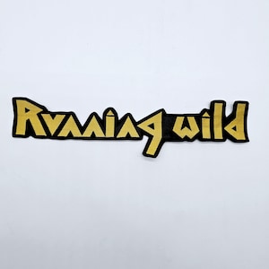 May include: A black and gold embroidered patch with the words "Running Wild" in a stylized font. The text is in gold, outlined in black, and the patch has a black background. The patch is rectangular.