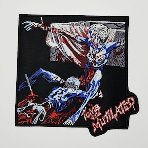 May include: A square embroidered patch featuring a dark graphic illustration of two figures in blue and white tones against a black background. The text Tomb of the Mutilated is stitched in red at the bottom right corner, with red accents throughout the design.