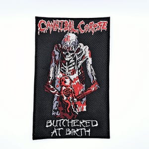 May include: Black rectangular patch featuring the text "CANNIBAL CORPSE" in red, dripping font. The patch depicts a skeletal figure in red and white, holding a smaller figure. The text "BUTCHERED AT BIRTH" is below the figure in white.