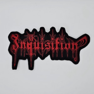 May include: Black embroidered patch with the word "Inquisition" in red gothic lettering. The patch has a black border and is set against a white background. The design features sharp, pointed elements.