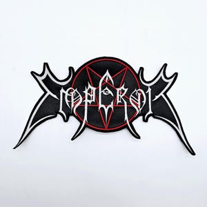 May include: Embroidered patch with the word "EMPEROR" in white gothic lettering. The patch has a black background with a red pentagram design in the centre. The patch has a unique shape with pointed edges and white trim.