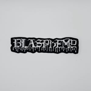May include: Black embroidered patch with the word "BLASPHEME" in white, gothic-style lettering. The patch has a black border with a dripping effect. The patch is rectangular and is likely for clothing or accessories.