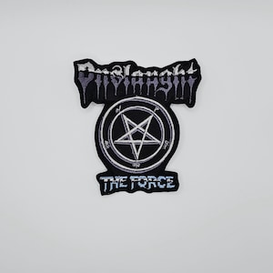 May include: A black and white embroidered patch with the text "Dismemberment Pyramids" above a circular emblem with a pentagram. The text "THE FORCE" is below the emblem. The patch has a jagged edge.