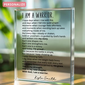 May include: A clear acrylic block with the text "I AM A WARRIOR" and a poem. The block has the word "PERSONALIZE" in a pink rectangle in the upper left corner. The poem is about strength and faith.