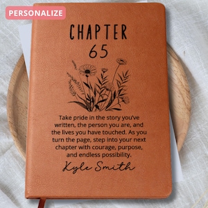 May include: A brown leather journal with the text "CHAPTER 65" and a quote about taking pride in the story you've written. The quote is followed by the name "Kyle Smith".