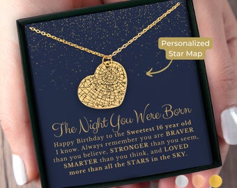 May include: A gold heart-shaped necklace with a star map design inside. The necklace comes in a blue box with a gold inscription that reads "The Night You Were Born" and a personalized message about being brave, strong, smart, and loved.
