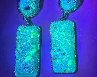Green splattered glow earrings