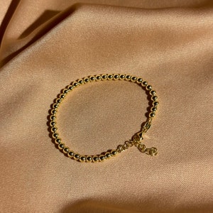 Bracelet en vermeil pois dorés 4 mm