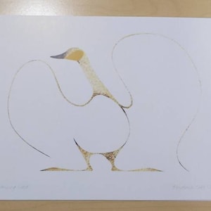 May include: A white rectangular art print featuring a minimalist line drawing of a goose in gold and grey tones. The goose is depicted with wings outstretched in a fluid motion. The text Dancing Goose is printed in the bottom left corner.