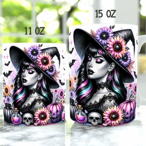May include: Two white ceramic mugs featuring a colourful illustration of a witch wearing a black hat, purple and pink flowers, and a pumpkin. The mug on the left says "11 oz" and the mug on the right says "15 oz".