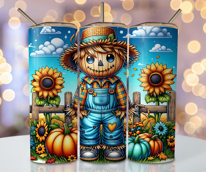 May include: A blue and yellow fall-themed tumbler with a cartoon scarecrow wearing a plaid shirt and overalls. The scarecrow is standing in front of a fence with sunflowers and pumpkins.