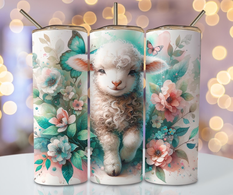 May include: Three stainless steel tumblers with a white background and a watercolor design of a cute lamb with blue and pink flowers.