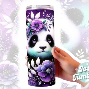 May include: A purple and white stainless steel tumbler with a graphic of a panda bear wearing a flower crown. The panda has black and white fur and blue eyes. The background is a purple and white floral design.