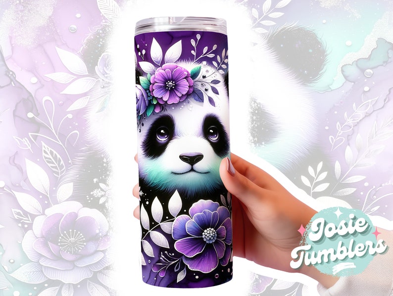 May include: A purple and white stainless steel tumbler with a graphic of a panda bear wearing a flower crown. The panda has black and white fur and blue eyes. The background is a purple and white floral design.