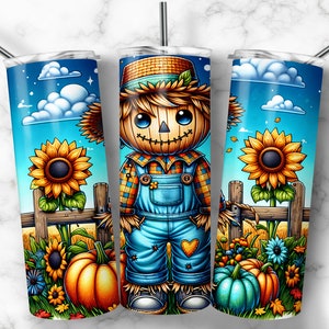 May include: A stainless steel tumbler with a colorful fall-themed design. The design features a cartoon scarecrow with a straw hat, overalls, and a plaid shirt. The scarecrow is standing in a field with sunflowers, pumpkins, and other fall foliage.