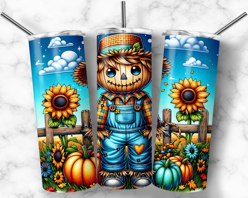 May include: A stainless steel tumbler with a colorful fall-themed design. The design features a cartoon scarecrow with a straw hat, overalls, and a plaid shirt. The scarecrow is standing in a field with sunflowers, pumpkins, and other fall foliage.