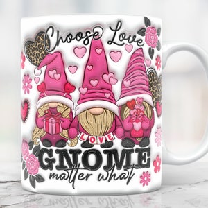 May include: White ceramic mug with a pink, white, and black design featuring three gnomes holding hearts and gifts. The text "Choose Love Gnome matter what" is printed on the mug.