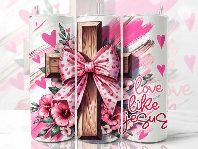 May include: A white tumbler featuring a pink and brown cross, a pink bow, and pink flowers. The tumbler displays the text "love like jesus".