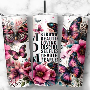 May include: Three stainless steel tumblers with a white background and a floral design. The tumblers feature a pink and purple butterfly with glitter accents. The middle tumbler has the word "MOM" in large black letters and the words "Strong, Beautiful, Loving, Inspiring, Selfless, Devote, Fearless" in smaller black letters.