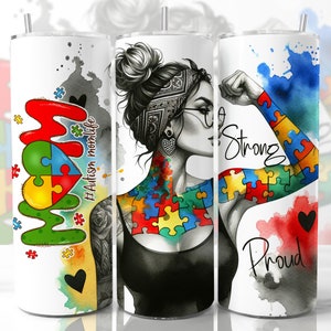 May include: A white tumbler with a watercolor design featuring a woman with a puzzle piece tattoo and the words "Strong" and "Proud". The tumbler also features the words "Mom" and "#Autism Momlife" in a colorful puzzle piece design.