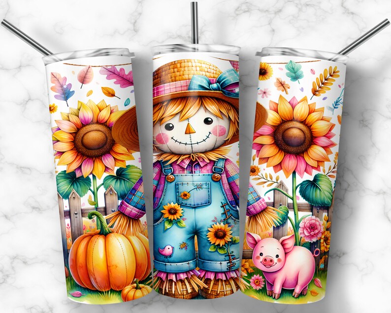 May include: Three stainless steel tumblers with a fall design. Each tumbler has a watercolour illustration of a scarecrow, sunflowers, pumpkins, and a pig. The tumblers have a straw and a white background.