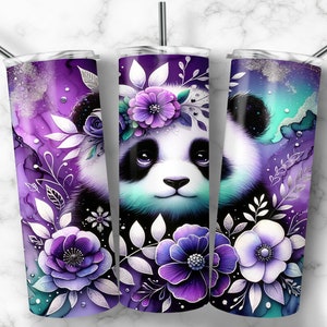 May include: A stainless steel tumbler with a purple and white floral design featuring a panda bear with a flower crown. The tumbler has a silver lid and a straw.