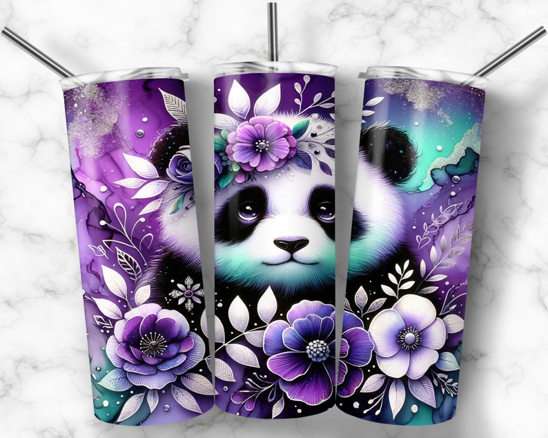May include: A stainless steel tumbler with a purple and white floral design featuring a panda bear with a flower crown. The tumbler has a silver lid and a straw.