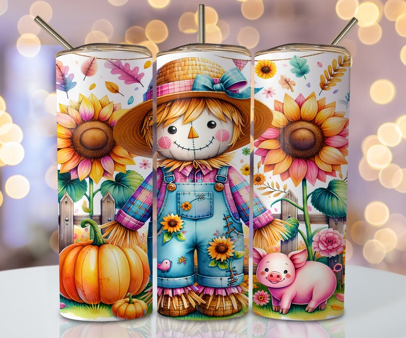 May include: A tumbler with a charming autumnal theme. The design showcases a scarecrow in dungarees, sunflowers, pumpkins, and a pig. The tumbler includes a straw and a lid. The background features a white fence and colourful leaves.