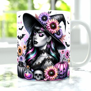 May include: White ceramic mug featuring a colourful illustration of a witch wearing a black hat, sunflowers, bats, and a potion bottle. The witch has long black hair with pink and blue streaks.