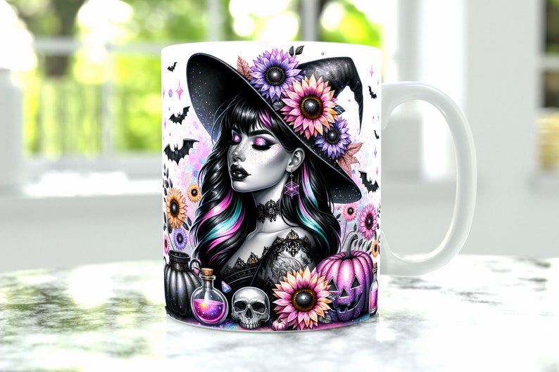 May include: White ceramic mug featuring a colourful illustration of a witch wearing a black hat, sunflowers, bats, and a potion bottle. The witch has long black hair with pink and blue streaks.