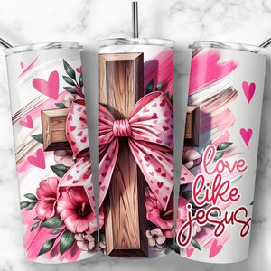 May include: A white tumbler with a pink and white design featuring a wooden cross with a pink bow and hearts. The text "love like jesus" is printed on the tumbler.